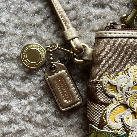 Coach wristlet with gold and flower accent - Picture 5 of 7
